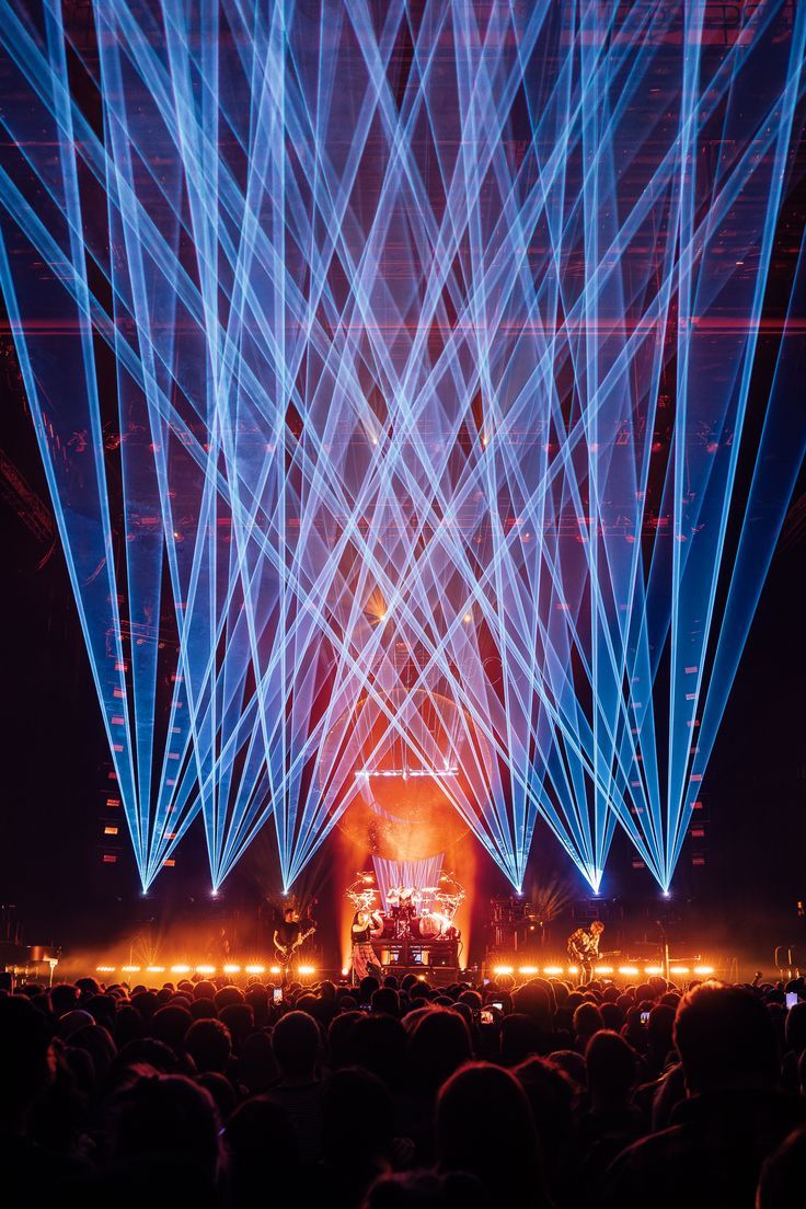 Crossing beams above a band on stage