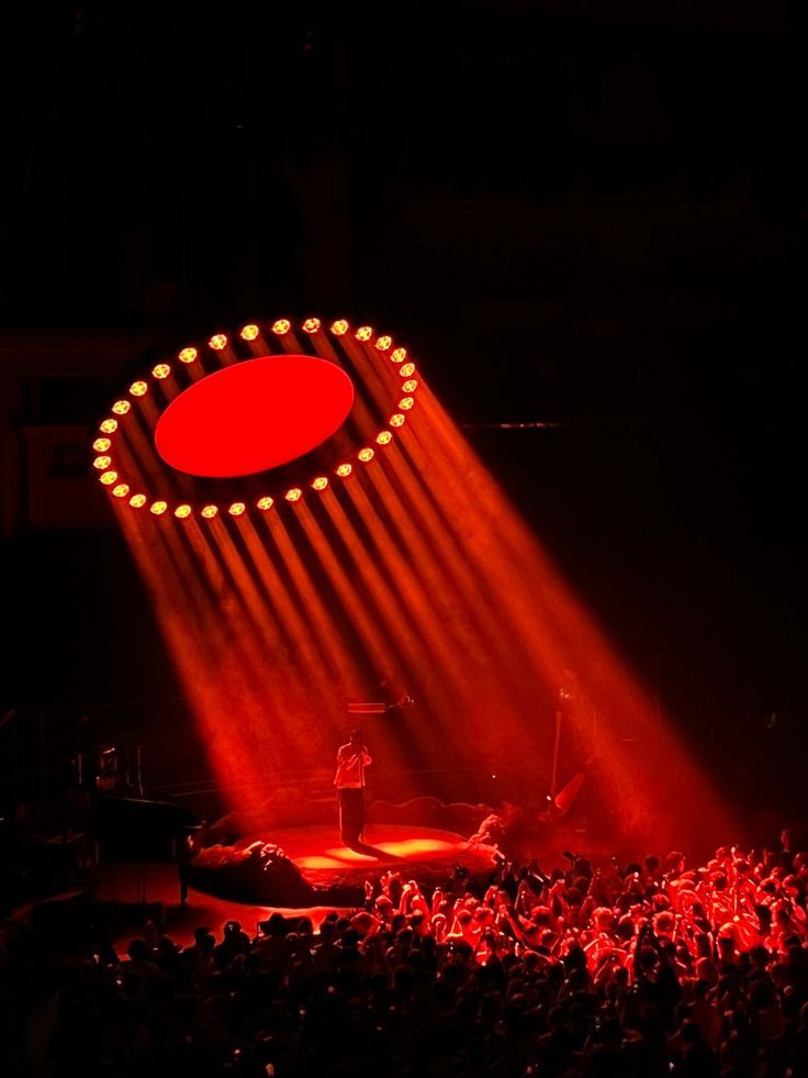 Performer under a ring of red light