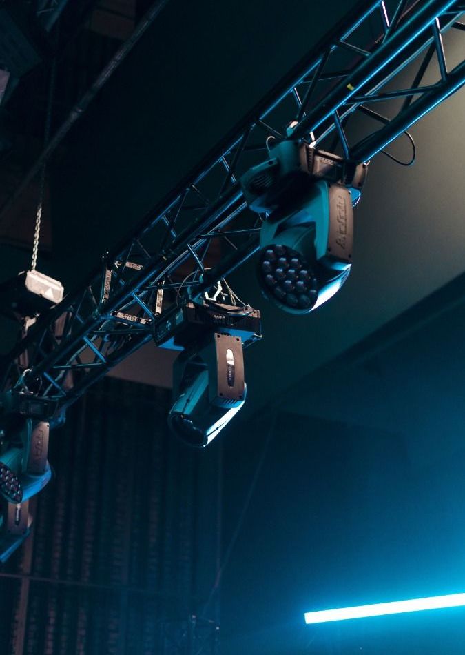 Moving head fixtures hung on a truss